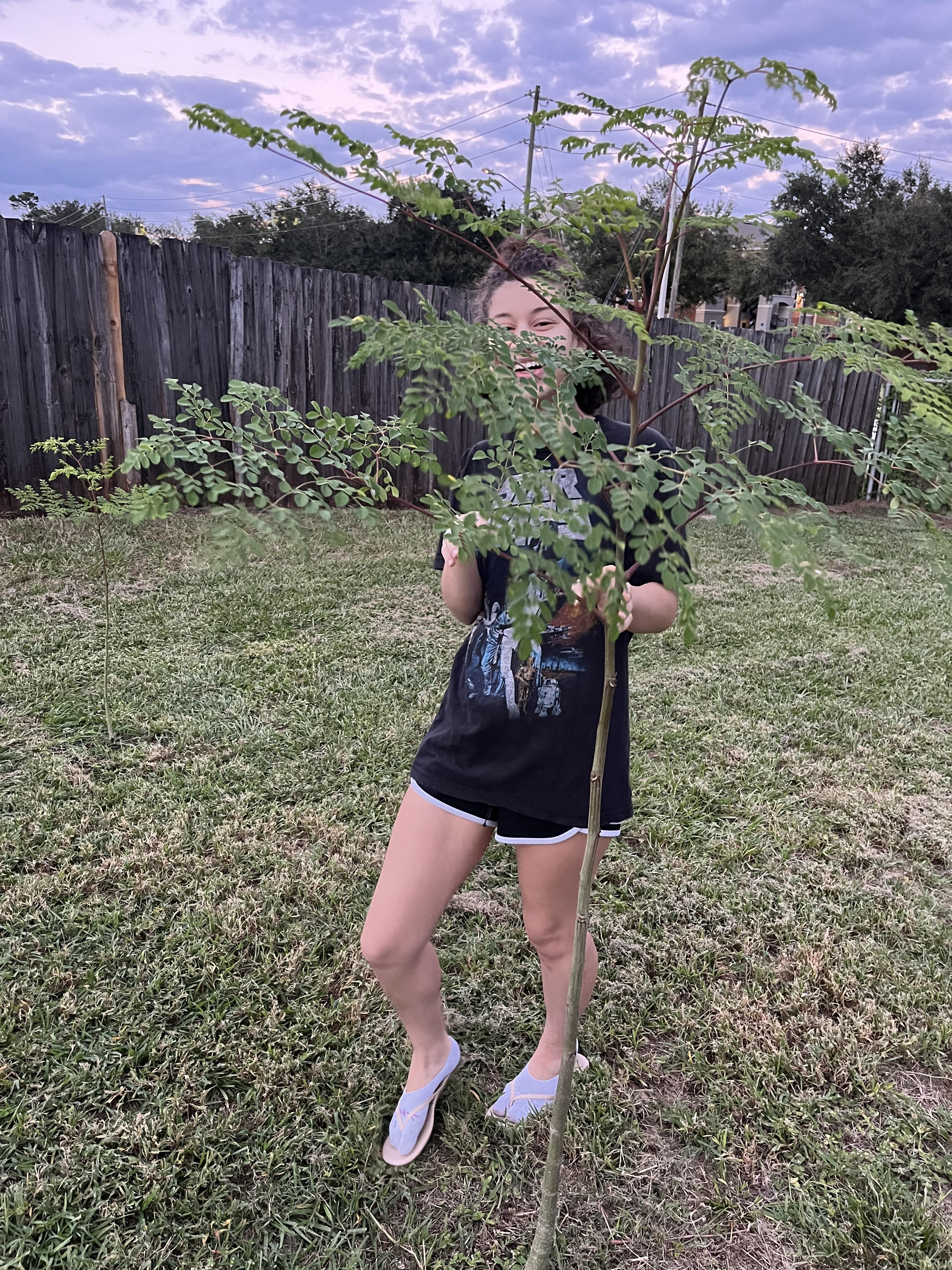 me next to the moringa tree